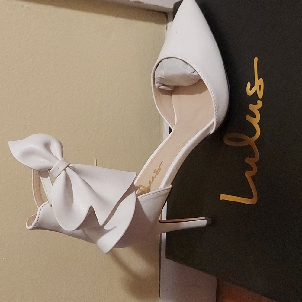 Lulus white bow heels, size 8.5
